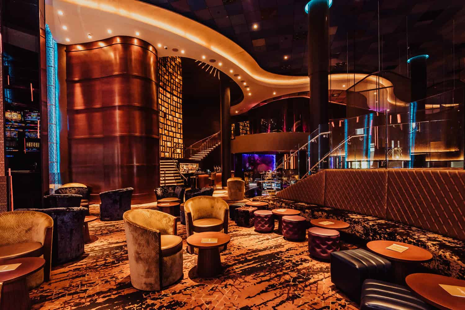 Luxurious lounge area inside Victoria Leeds shopping centre with plush seating and ambient lighting.