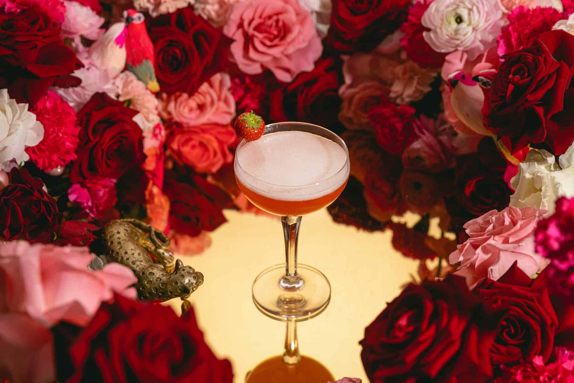 Elegant mocktail surrounded by red and pink roses at Victoria Leeds.