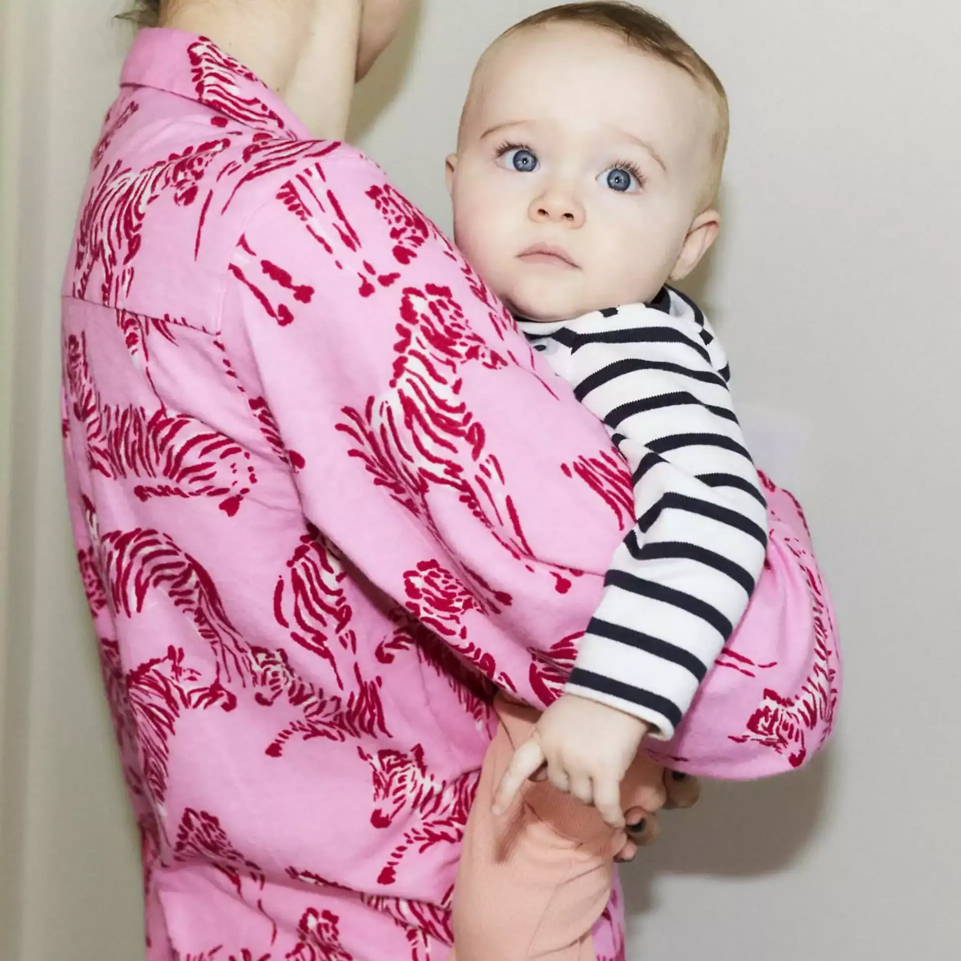 Maternity coat featuring animal print, perfect for expecting mothers.