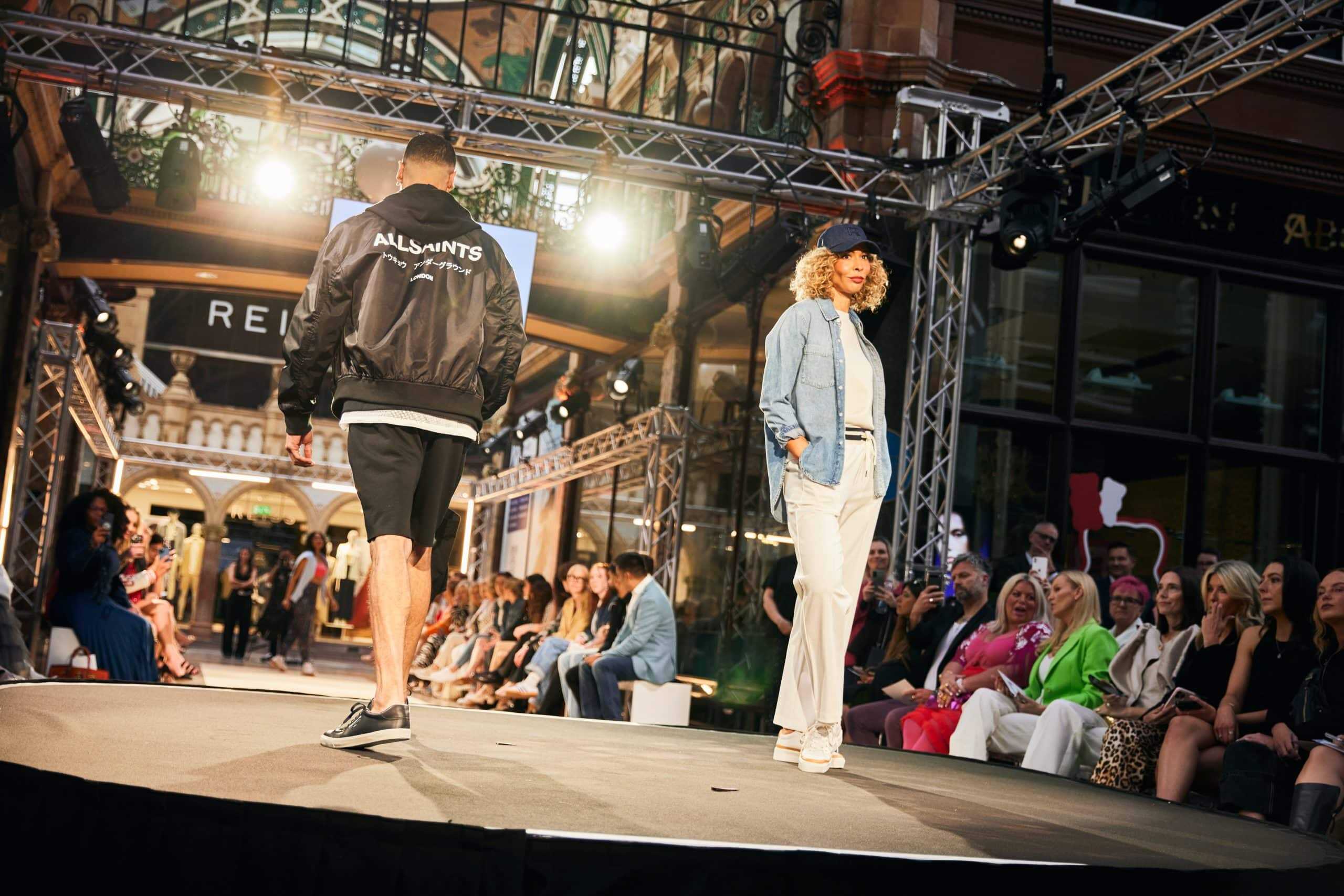 Elegant model walking runway at Victoria Leeds Fashion Week 2025 event.