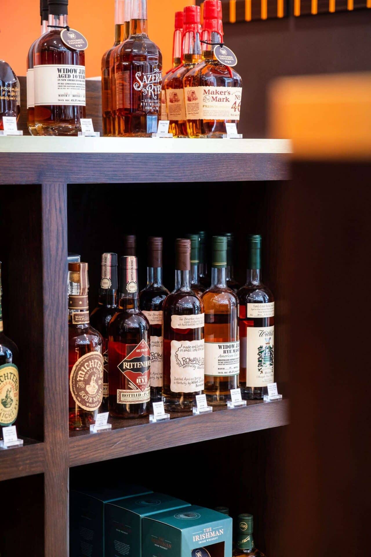 Assorted bottles of premium whisky and spirits on display at Victoria Leeds store.