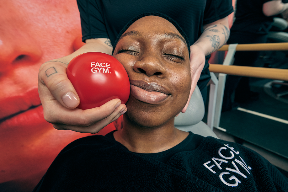 Woman enjoying facial workout with FaceGym ball at Victoria Leeds.