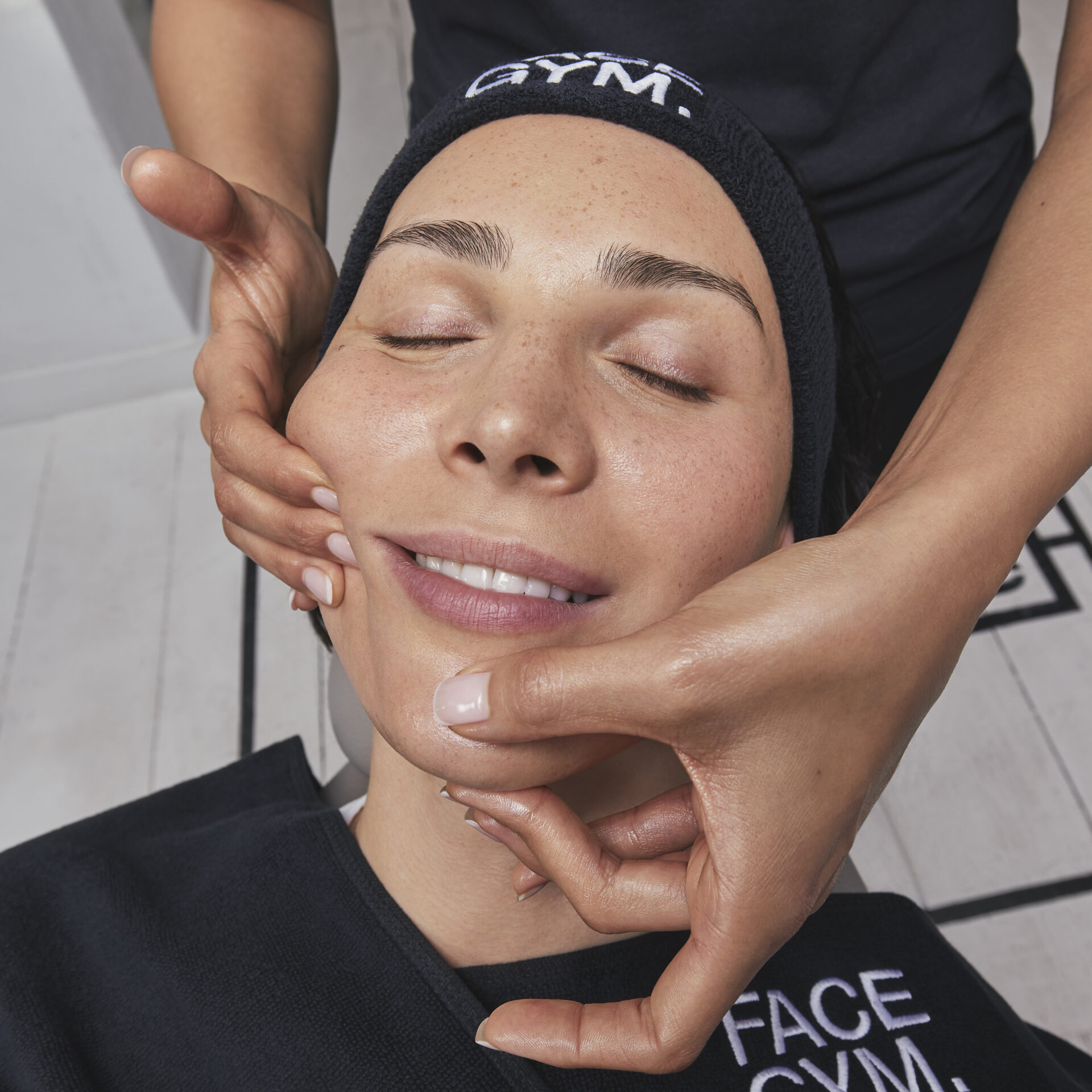 Woman receiving facial massage at Victoria Leeds FaceGym.