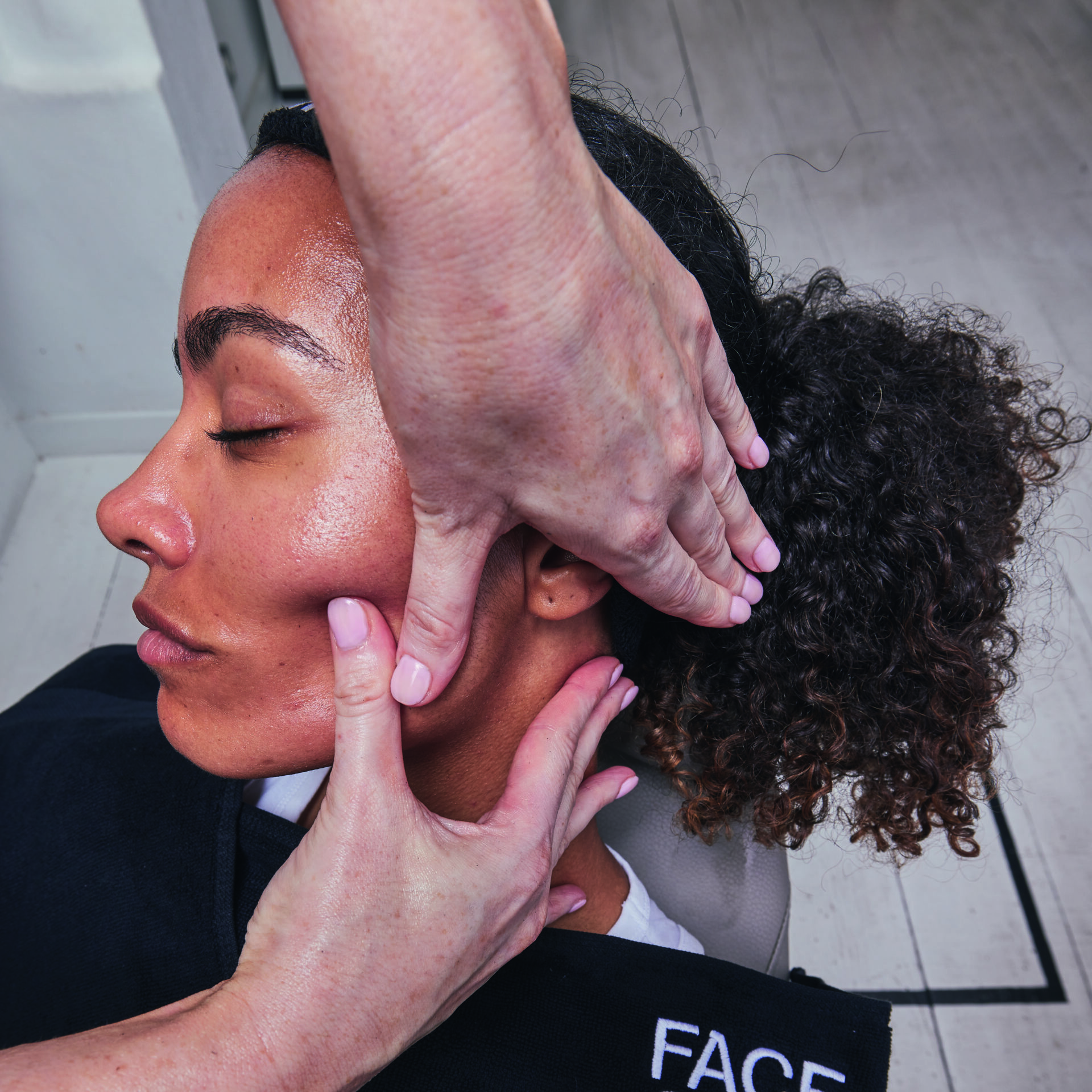 Woman receiving facial massage at Victoria Leeds FaceGym.