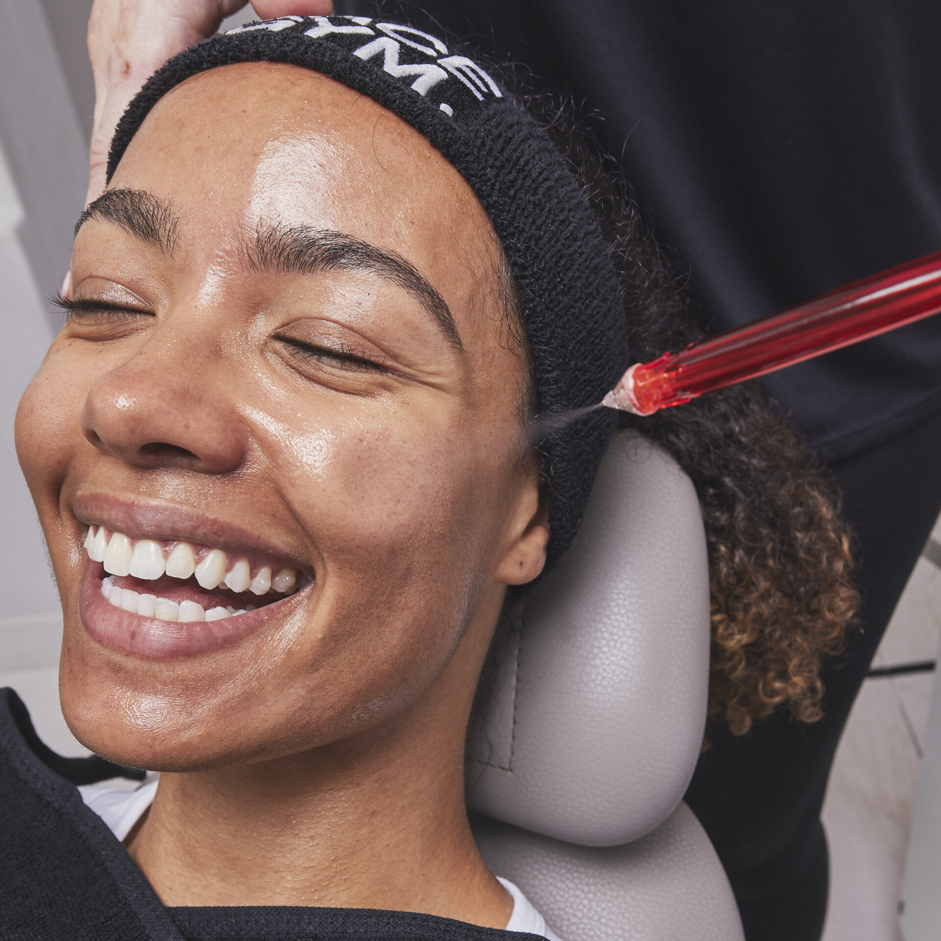 Woman receiving facial treatment at FaceGym in Victoria Leeds.