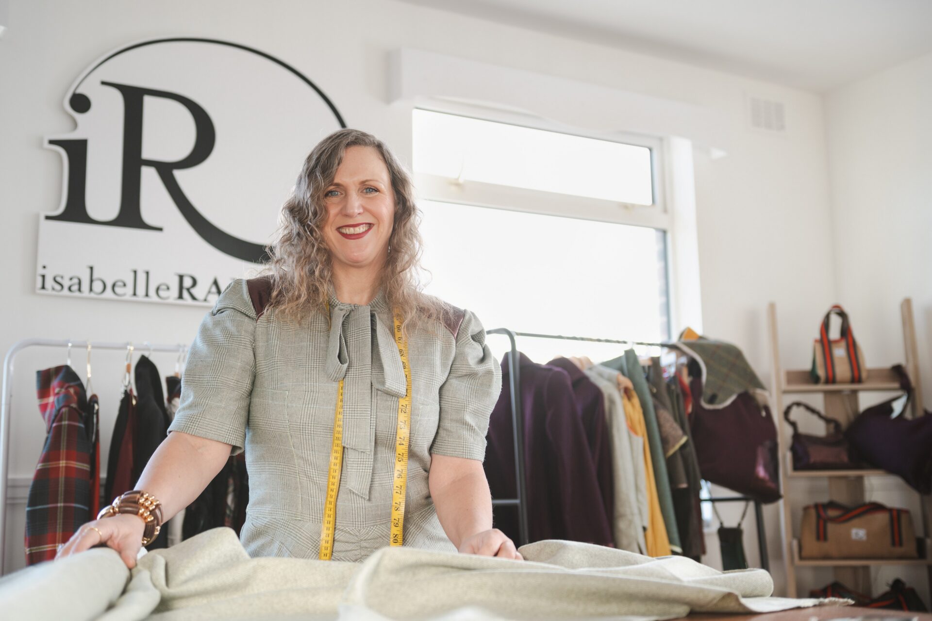 Isabelle Randall at her pop-up shop in Victoria Leeds with clothing and accessories.