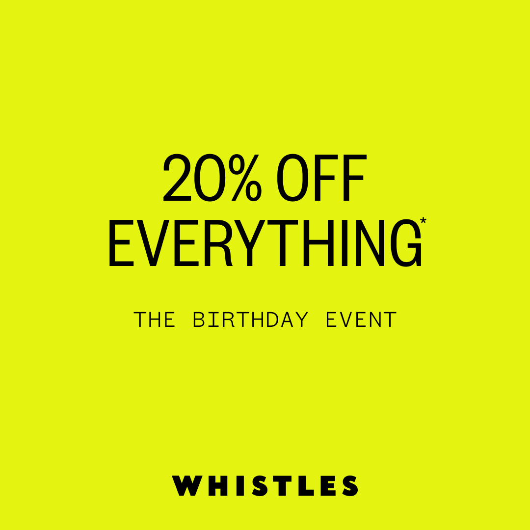 Bright yellow promotional poster for Whistles birthday event with 20% off everything.