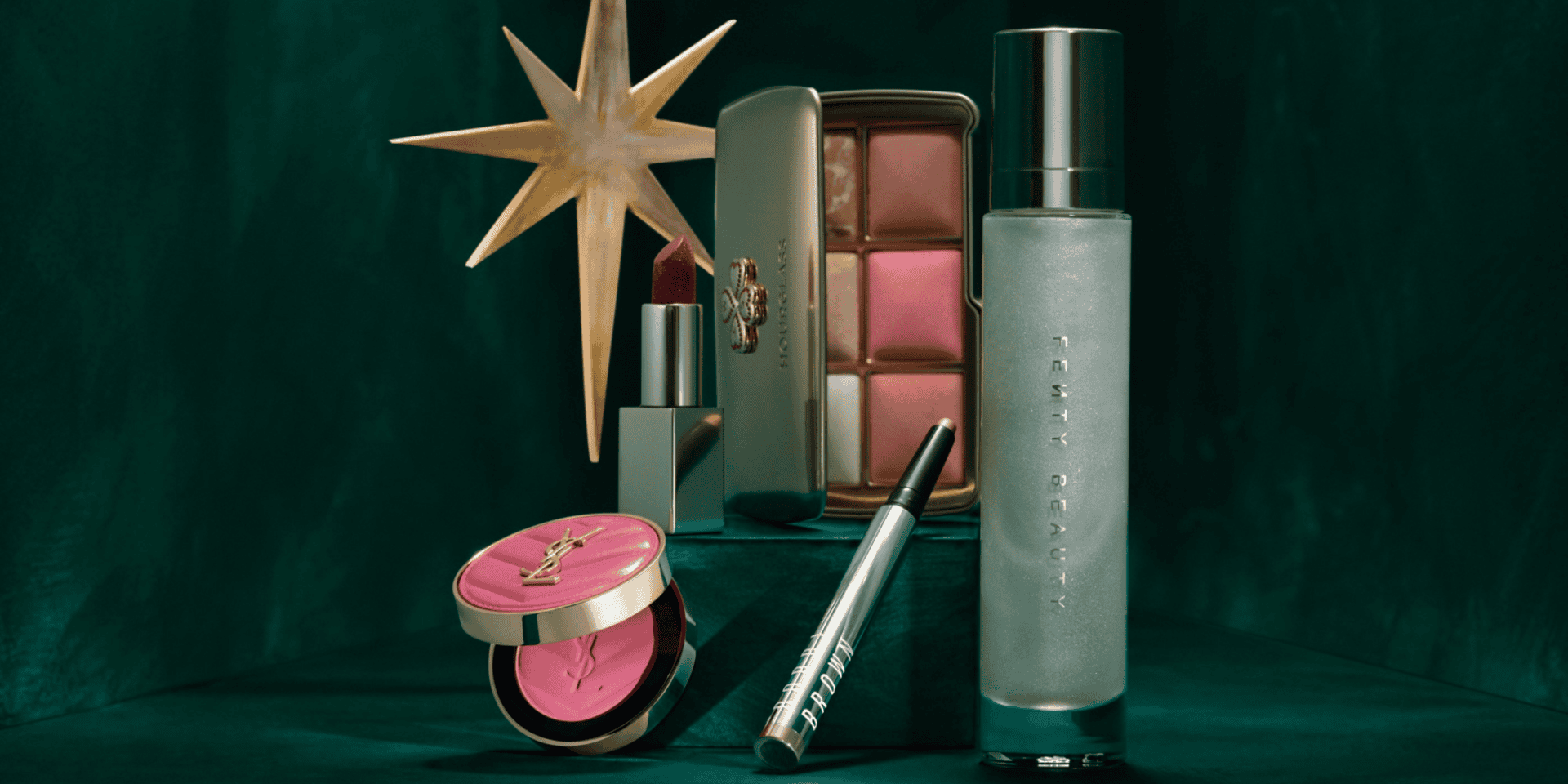 Makeup products and tools displayed on a green background for Victoria Leeds event.