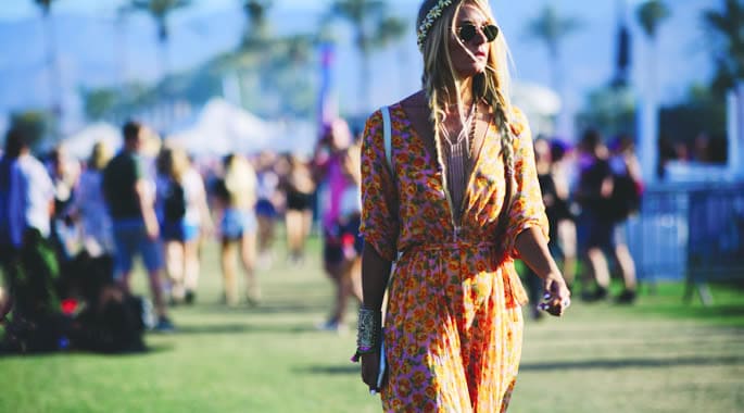 Woman in floral festival attire with sunglasses at Victoria Leeds, perfect for summer festivals.