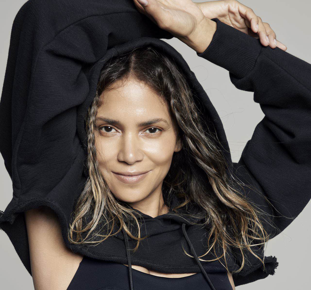 Activewear model wearing Sweaty Betty x Halle Berry collection for fitness and style.