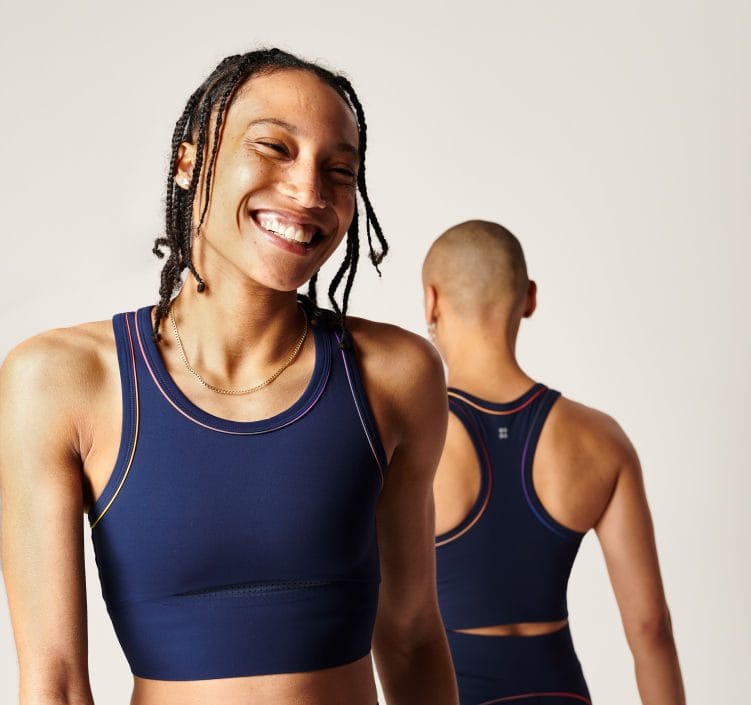 Women wearing Sweaty Betty Pride Collection activewear, smiling and enjoying fitness outdoors.