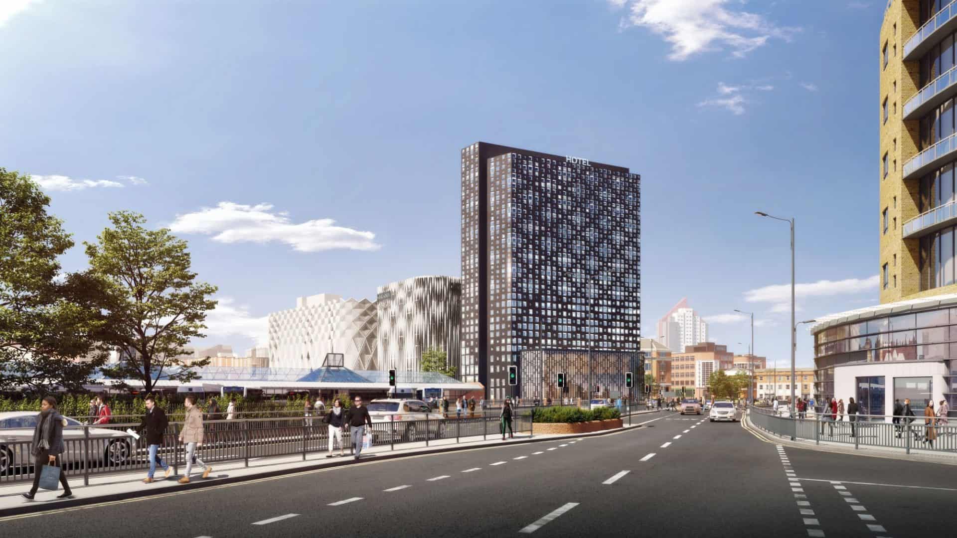 Modern hotel building at Victoria Leeds with cityscape background.