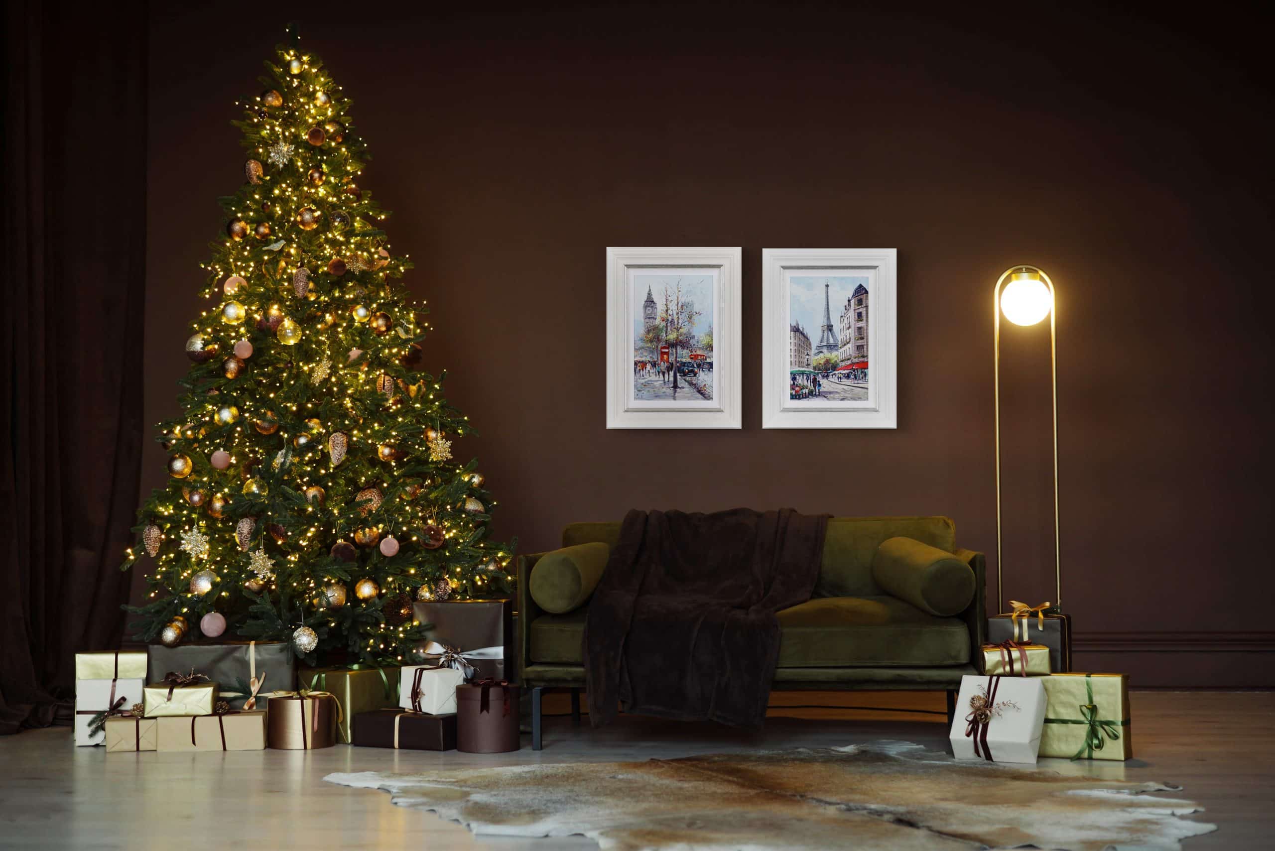 Festive Christmas tree decorated with lights and ornaments, surrounded by wrapped presents at Victor.