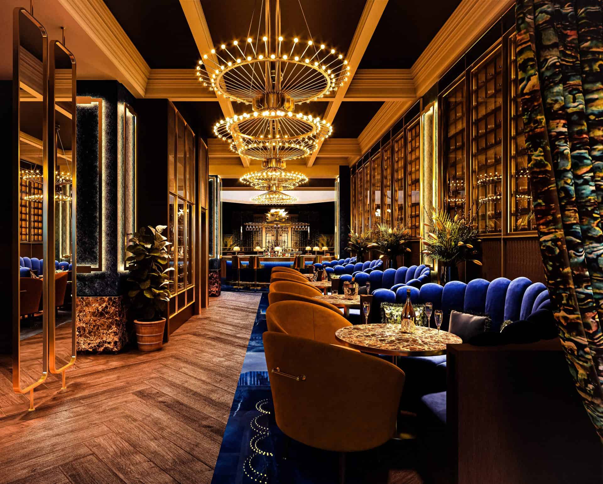 Luxurious lounge interior featuring gold chandeliers, velvet sofas, and sophisticated decor for cele.