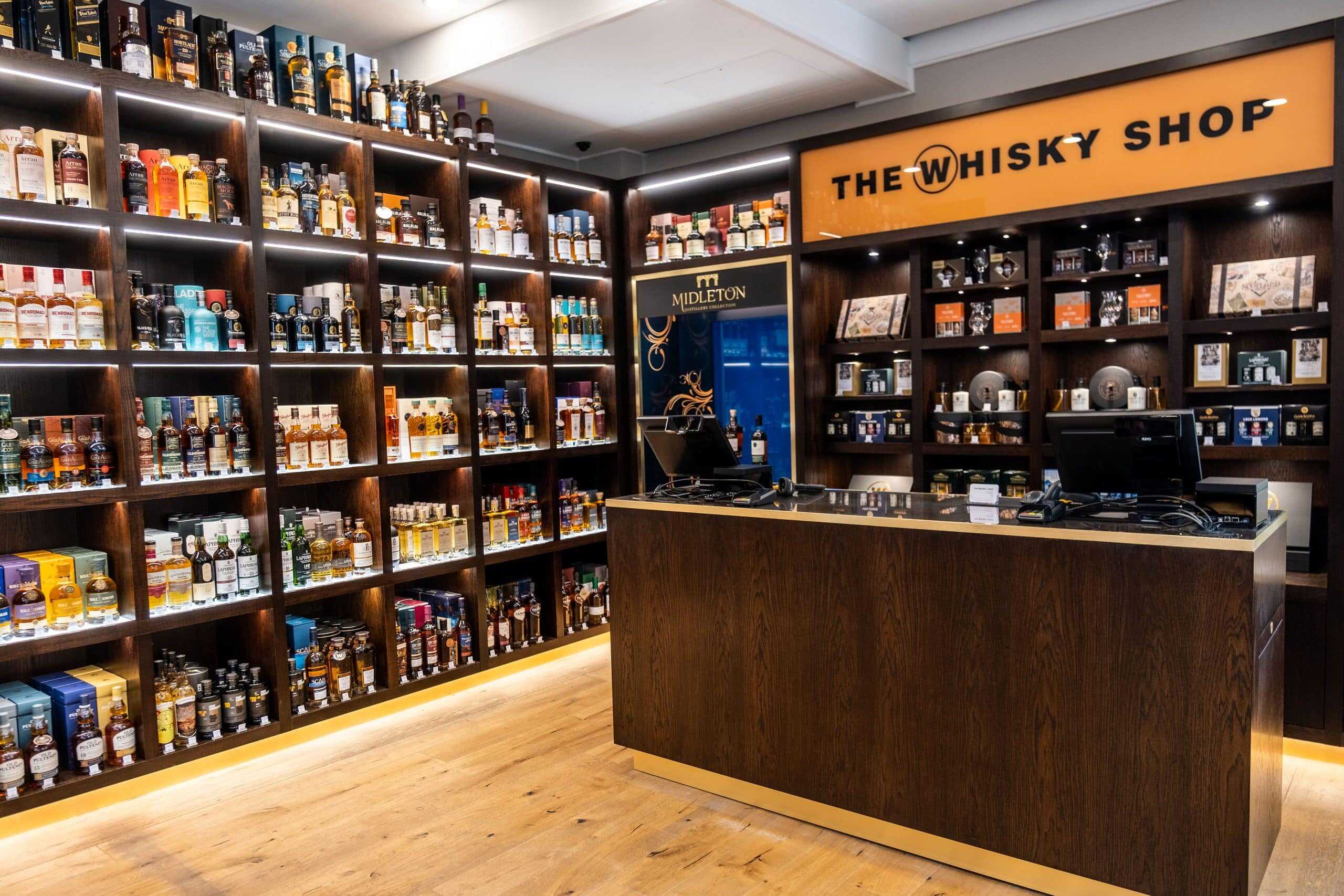 Interior of The Whisky Shop at Victoria Leeds, showcasing a wide selection of whisky bottles.