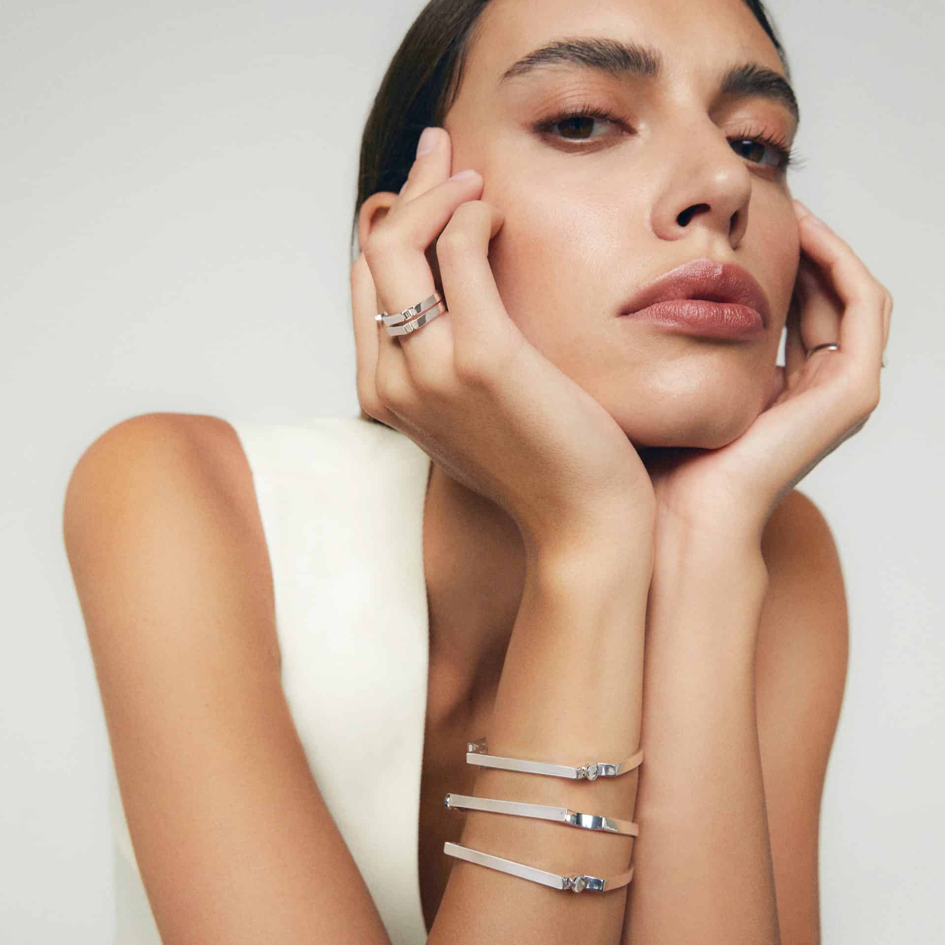 Stylish woman with sophisticated jewelry at Victoria Leeds shopping centre.