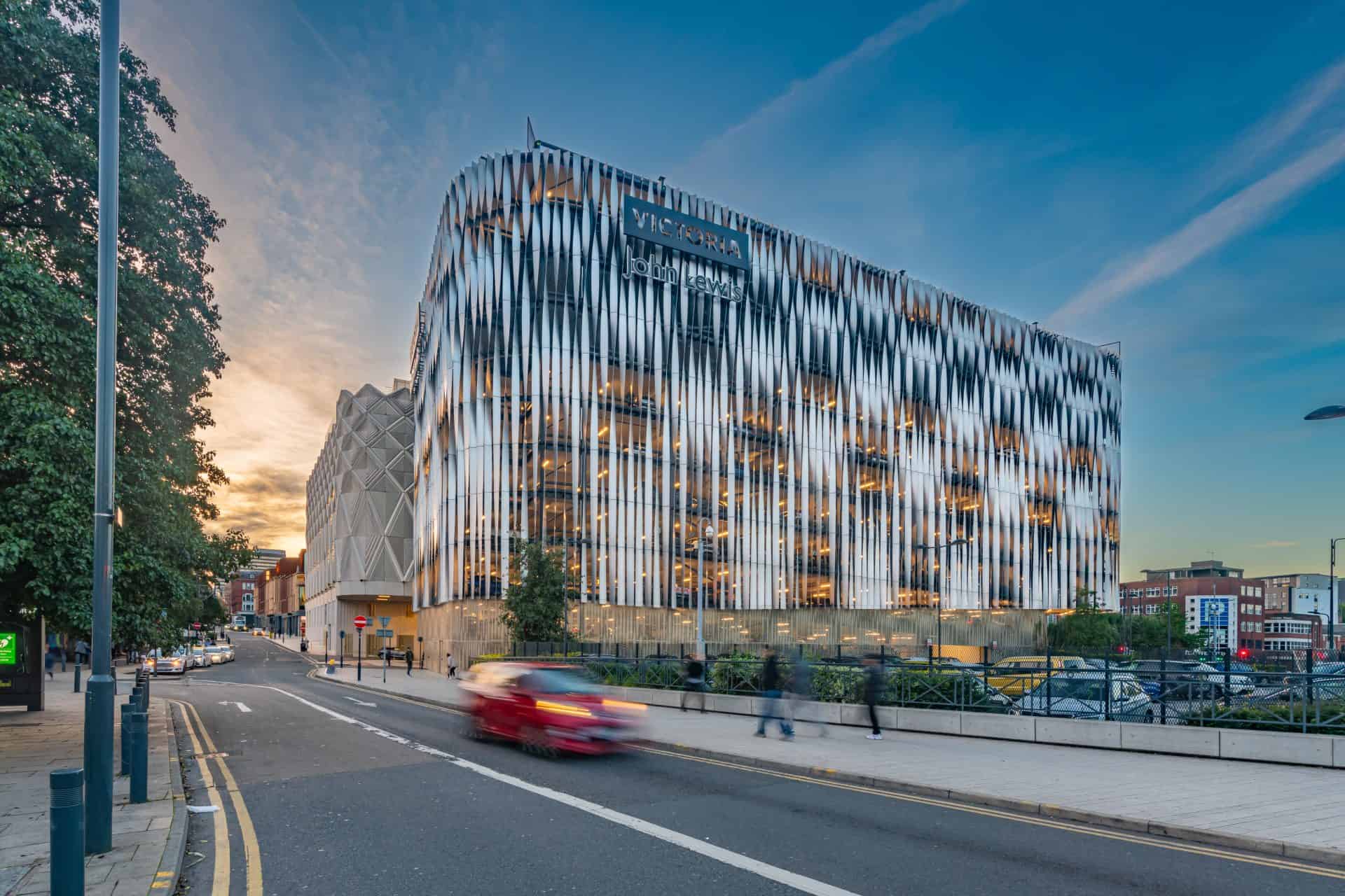 Victoria Leeds parking lot with modern building in Leeds city centre.
