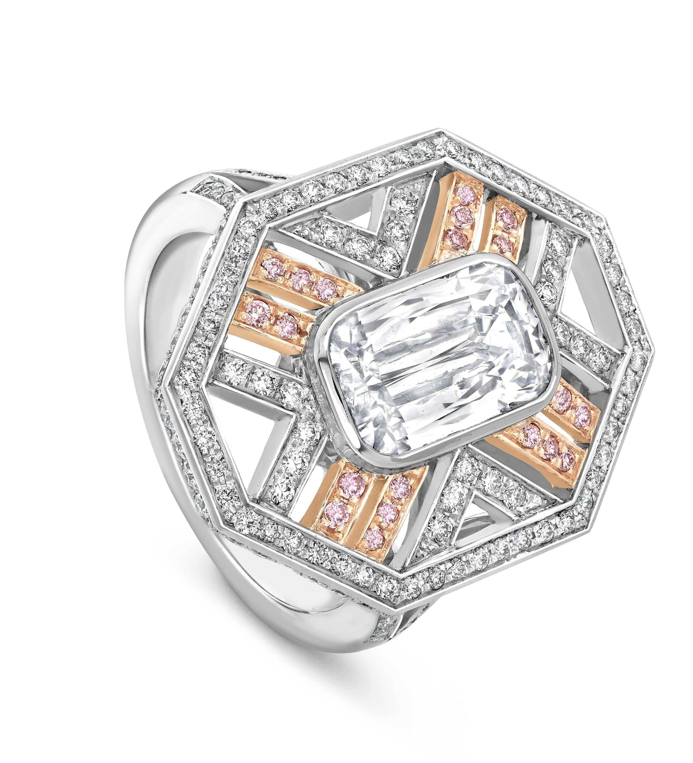 Elegant diamond ring featuring a large central gemstone and detailed design.