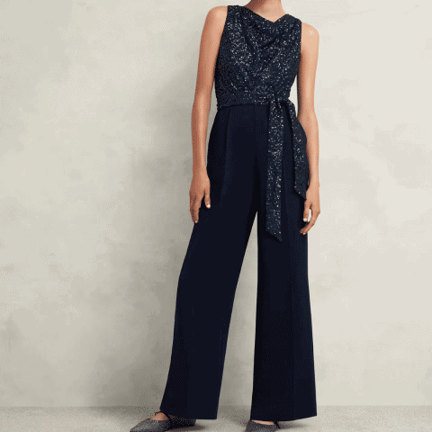 Elegant navy sequin jumpsuit perfect for New Year's Eve parties. Stylish, comfortable, and ideal for.