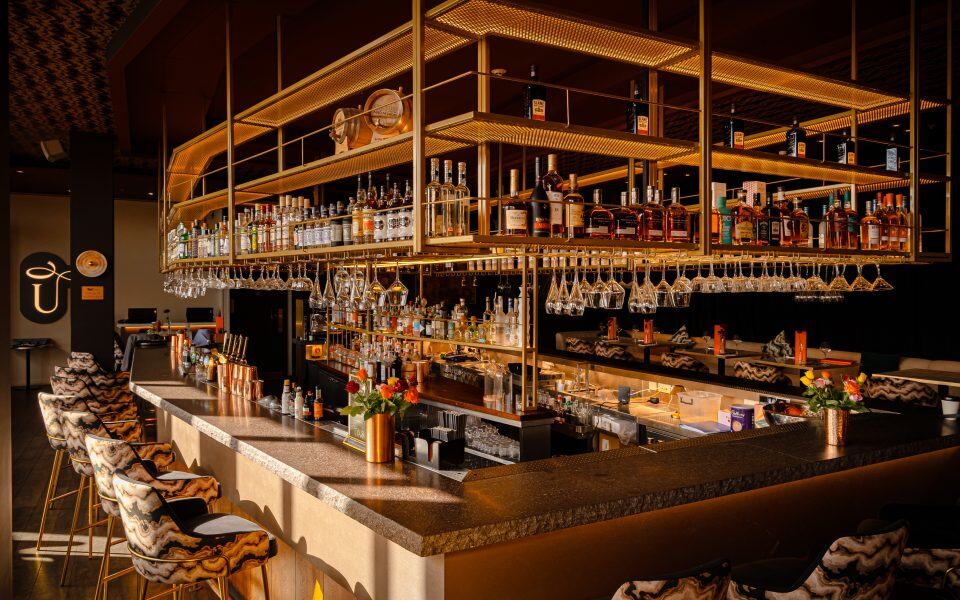 Elegant bar area at Victoria Leeds showcasing premium spirits and stylish decor.