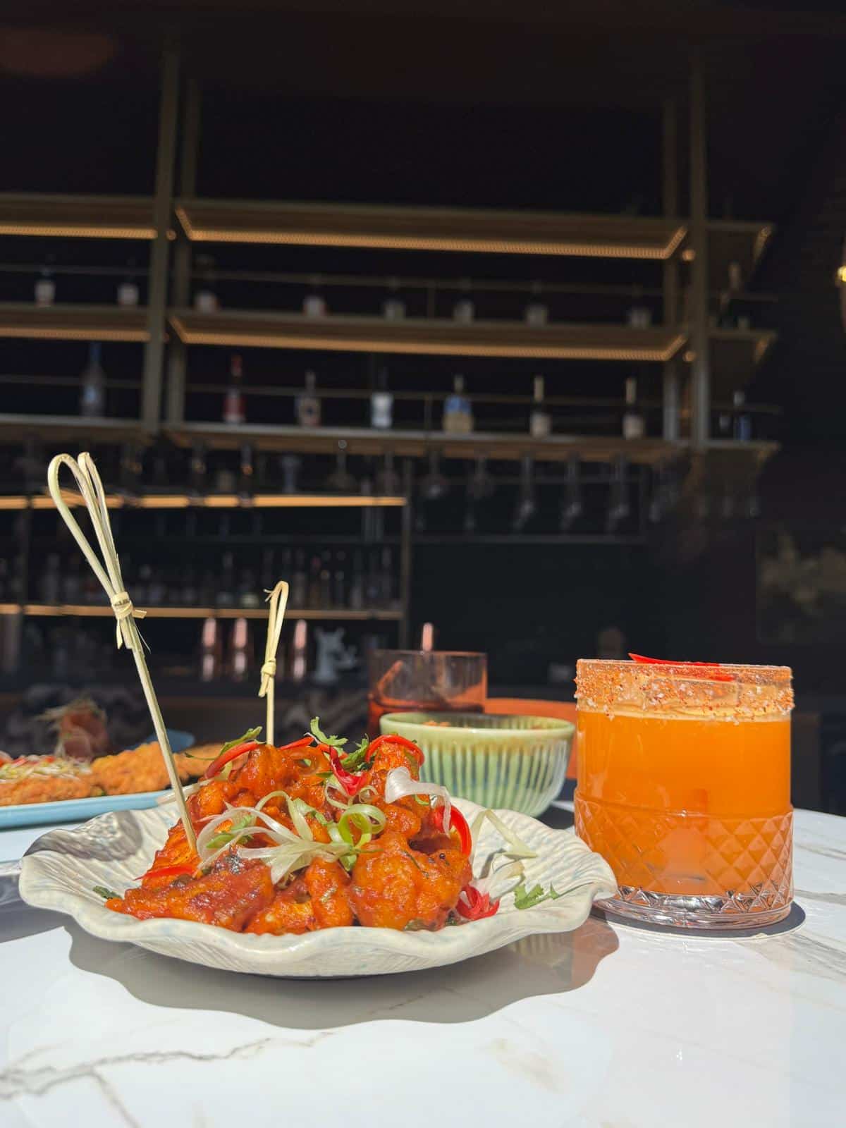 Delicious Asian-inspired chicken dish with a refreshing cocktail at Victoria Leeds. Perfect for a st.