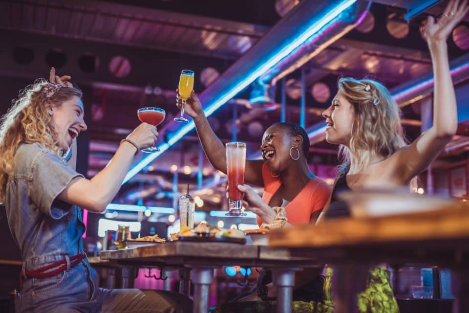 Women enjoying drinks and celebrating at Victoria Leeds nightlife venue.