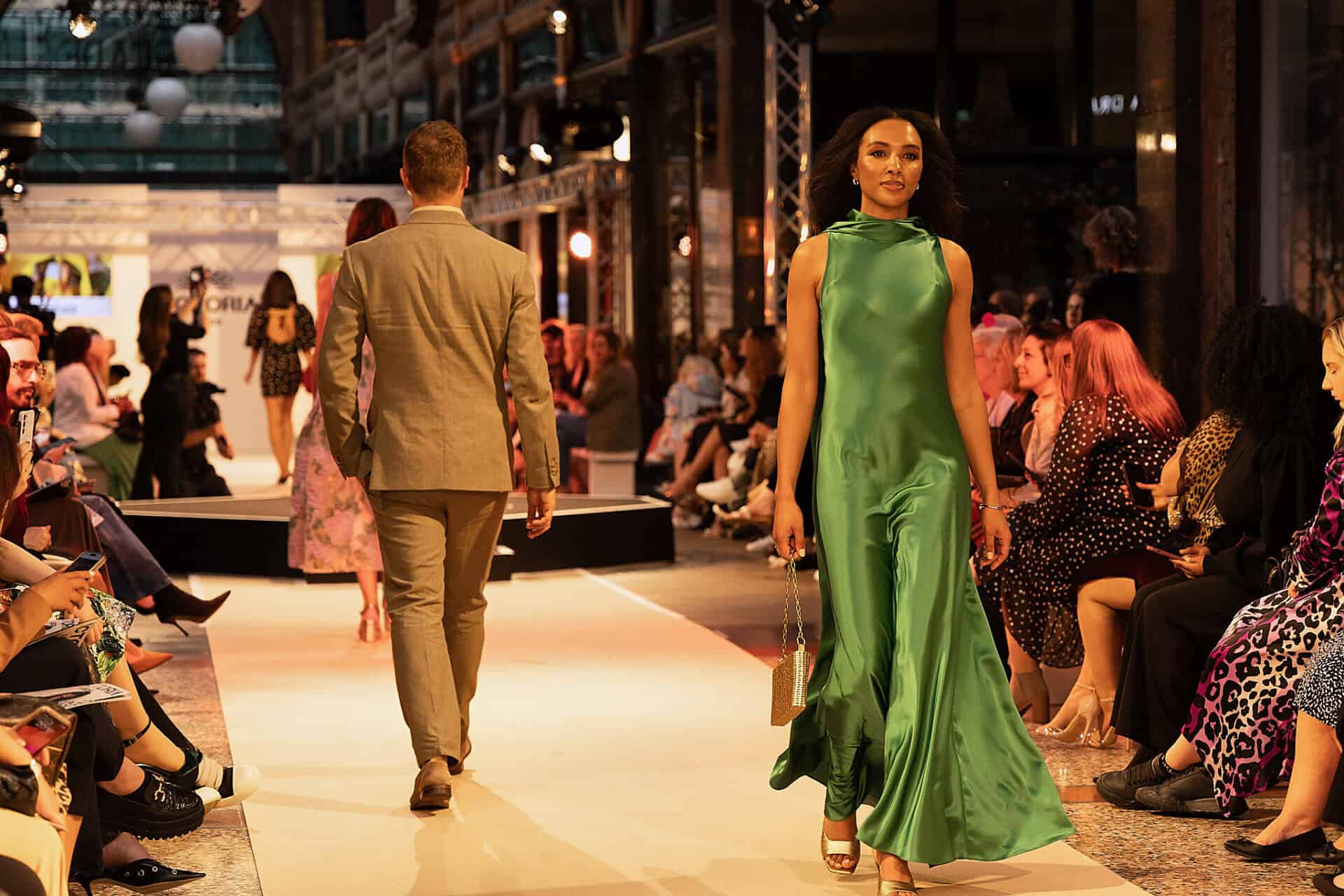 Elegant green evening gown on runway at Victoria Leeds Fashion Week 2026.