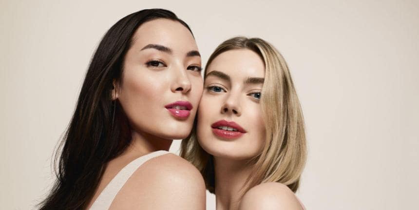 Elegant women with flawless makeup at John Lewis Clarins Beauty Party, Victoria Leeds.